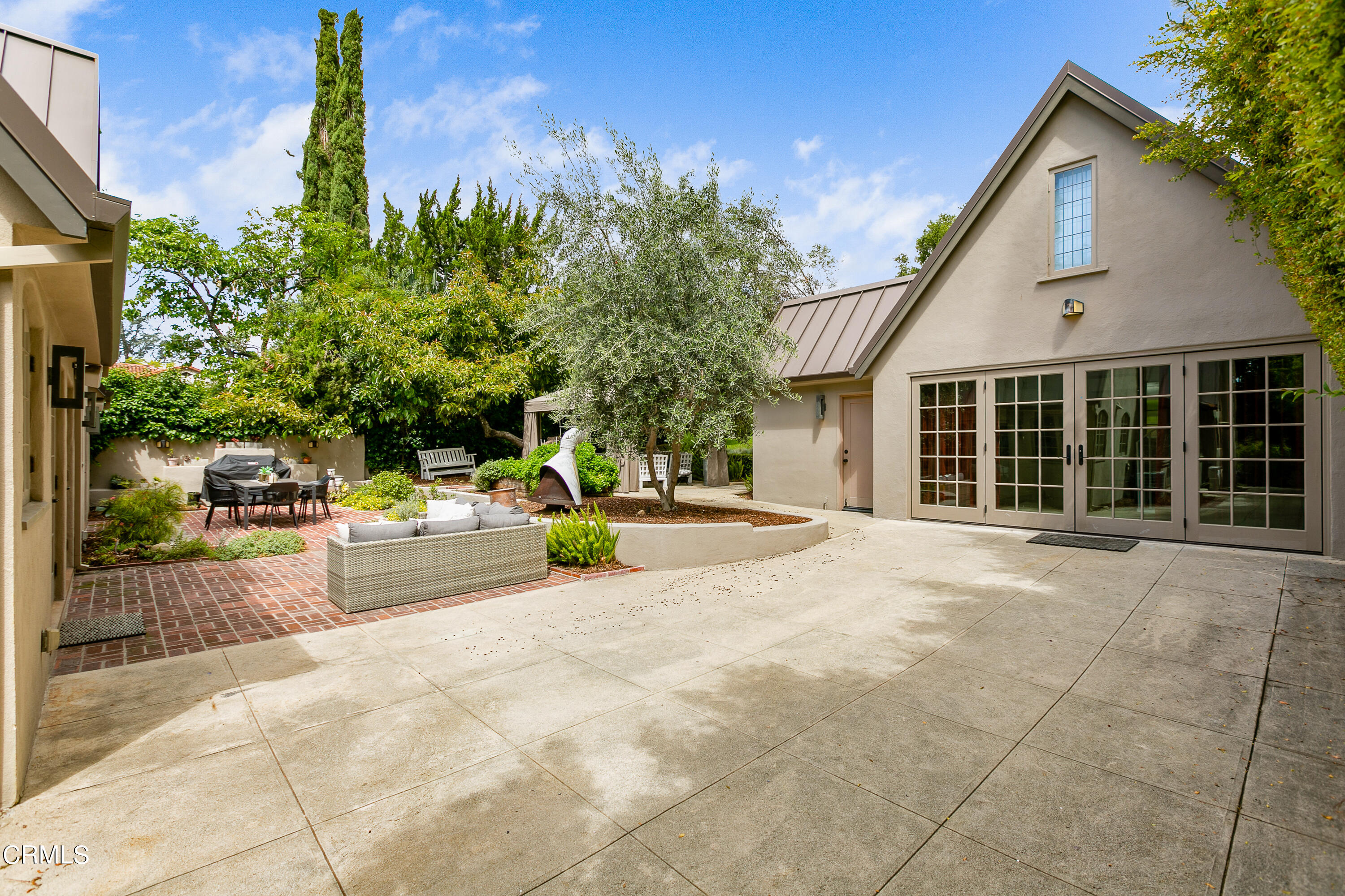 1665 Braeburn Road Altadena, CA 91001 - Photo 26 of 33 a view of a house with backyard and a car parked beside a road