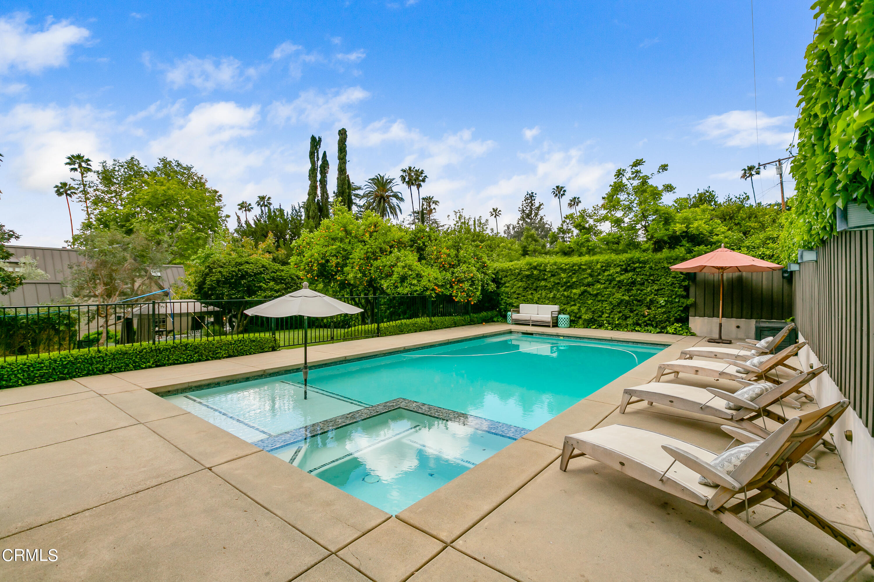 1665 Braeburn Road Altadena, CA 91001 - Photo 32 of 33 a swimming pool with lawn chairs and plants