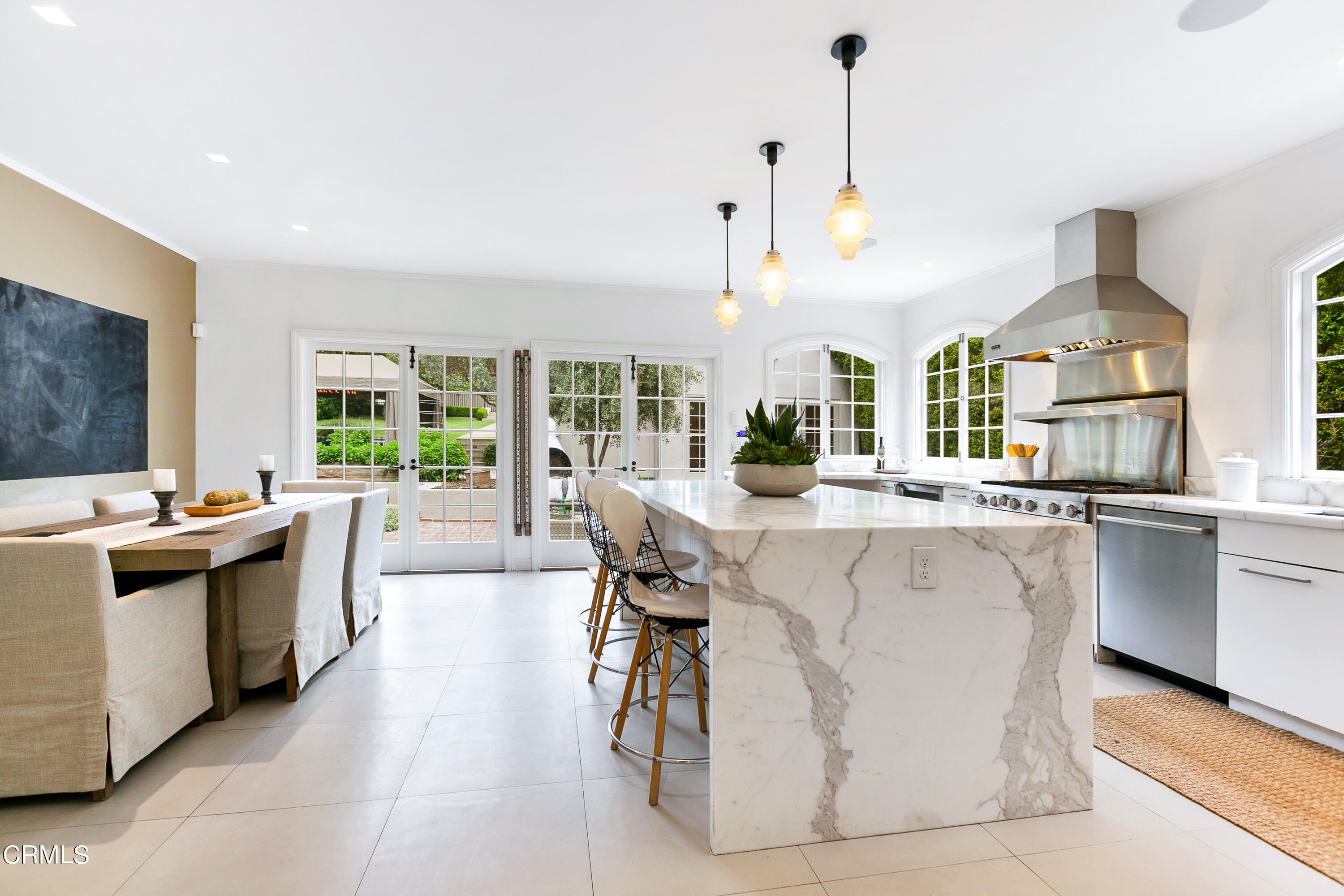 1665 Braeburn Road Altadena, CA 91001 - Photo 8 of 33 a kitchen with stainless steel appliances a stove a sink a oven a dining table and chairs