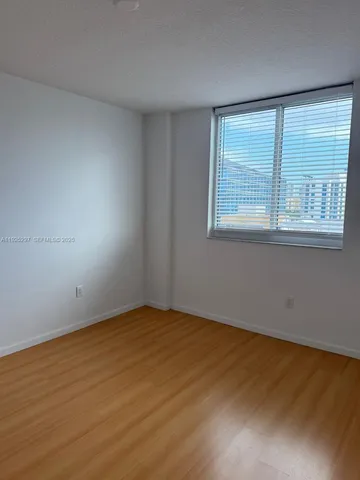 a kitchen with stainless steel appliances a stove and a microwave