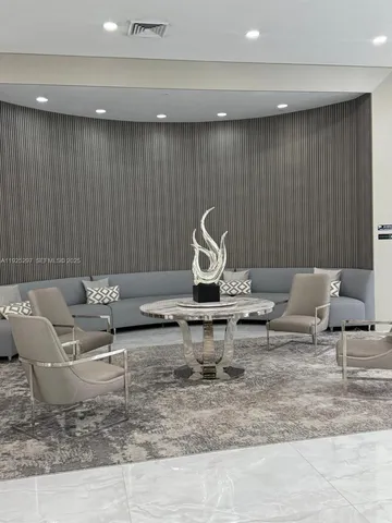 a view of a living room and kitchen