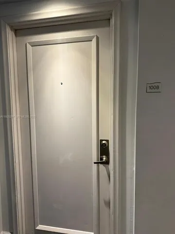 a bathroom with a sink a toilet a mirror and shower