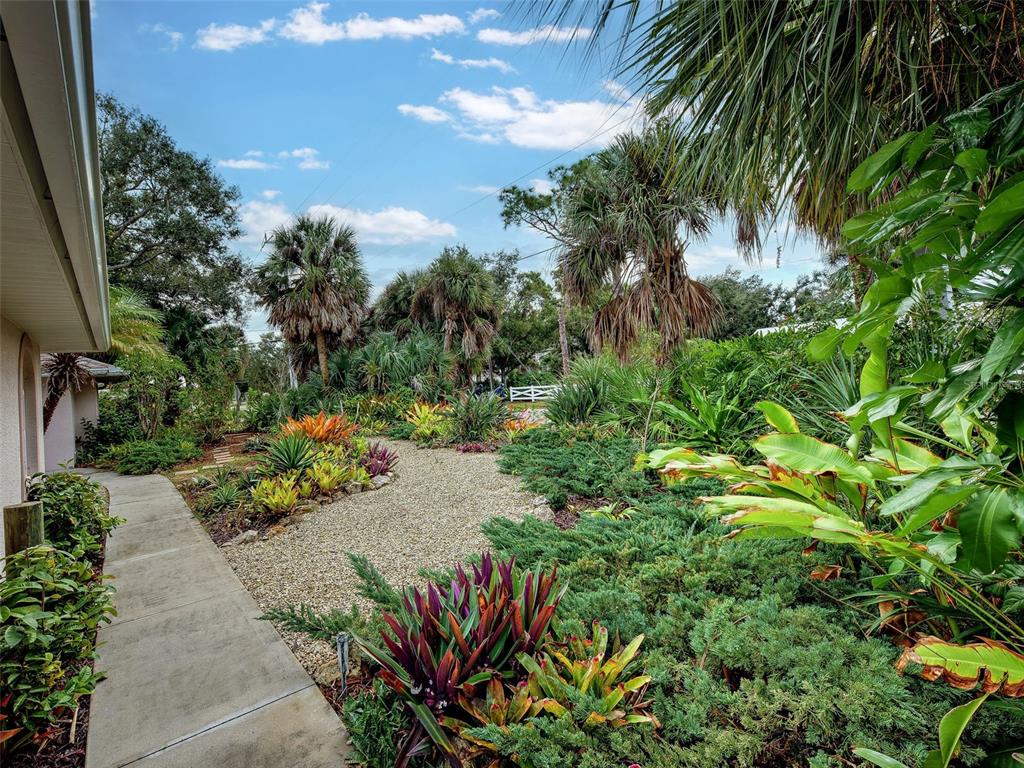 6265 Pheasant Road Venice, FL 34293 - Photo 2 of 70 a view of a garden with flowers