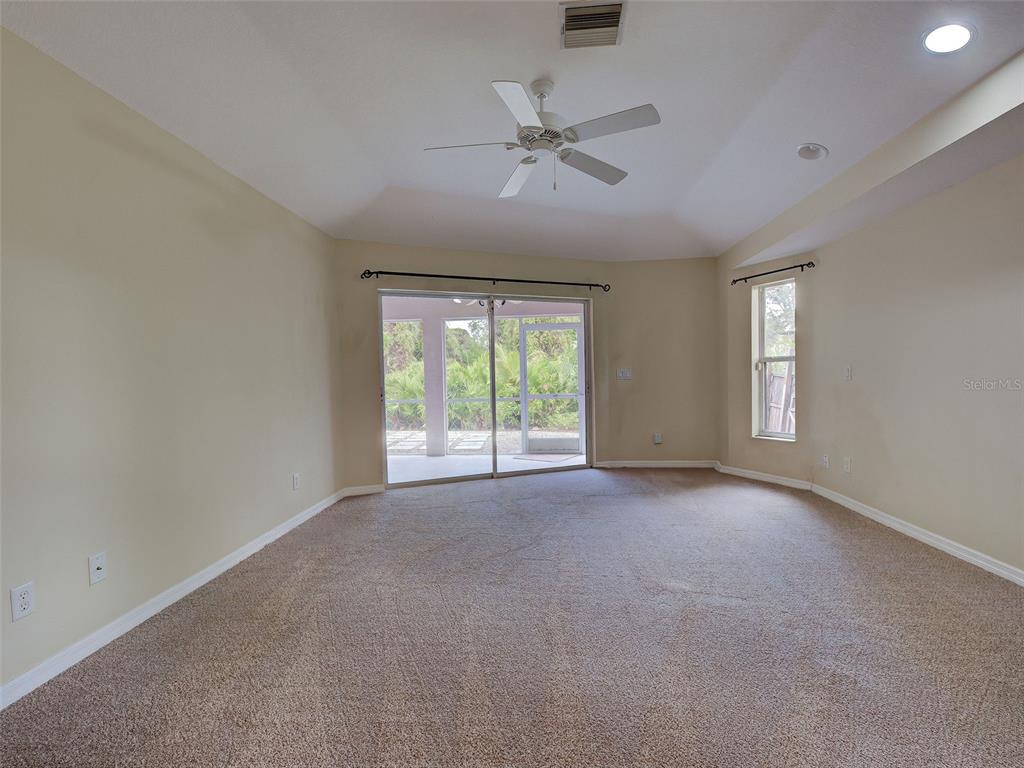 6265 Pheasant Road Venice, FL 34293 - Photo 28 of 70 a view of a livingroom with a ceiling fan and window