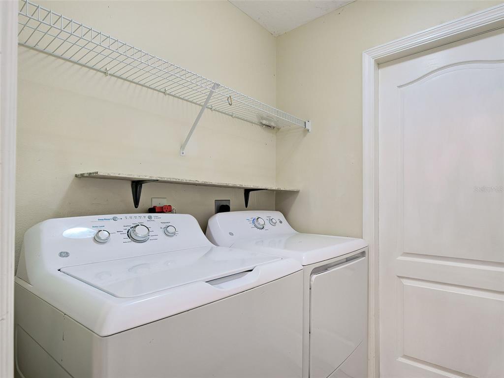 6265 Pheasant Road Venice, FL 34293 - Photo 50 of 70 a utility room with dryer and washer