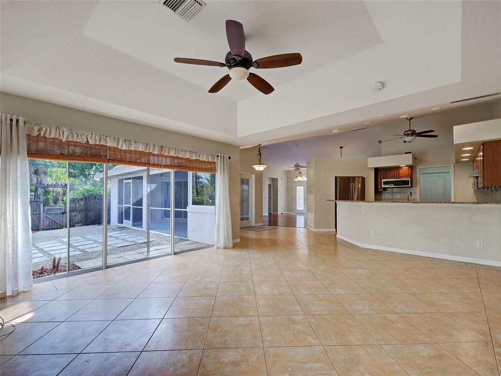 6265 Pheasant Road Venice, FL 34293 - Photo 55 of 70 a view of a livingroom with a ceiling fan and window