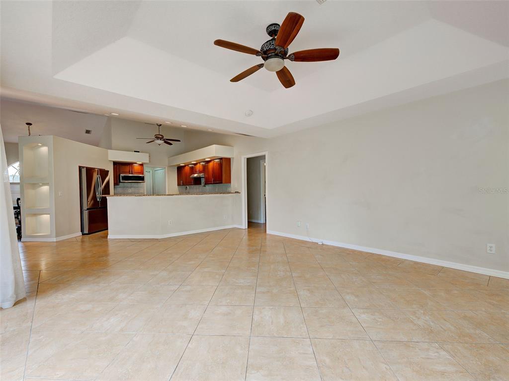 6265 Pheasant Road Venice, FL 34293 - Photo 57 of 70 a view of a livingroom with a ceiling fan and window