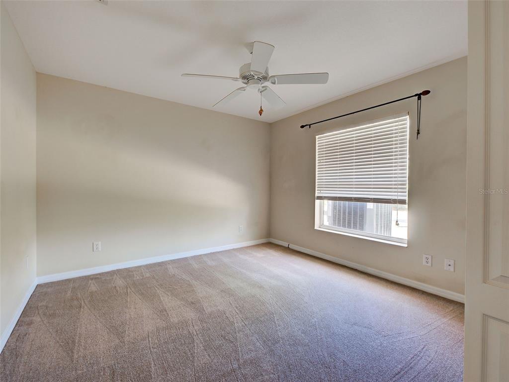 6265 Pheasant Road Venice, FL 34293 - Photo 59 of 70 an empty room with a window and a ceiling fan