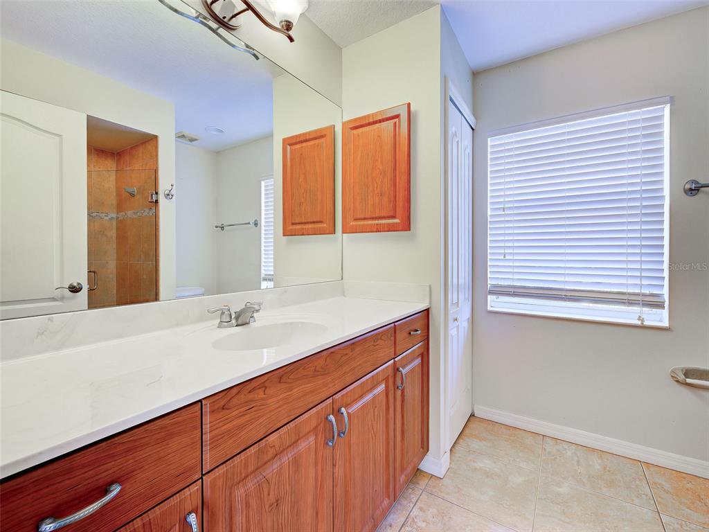 6265 Pheasant Road Venice, FL 34293 - Photo 61 of 70 a bathroom with a sink and a mirror