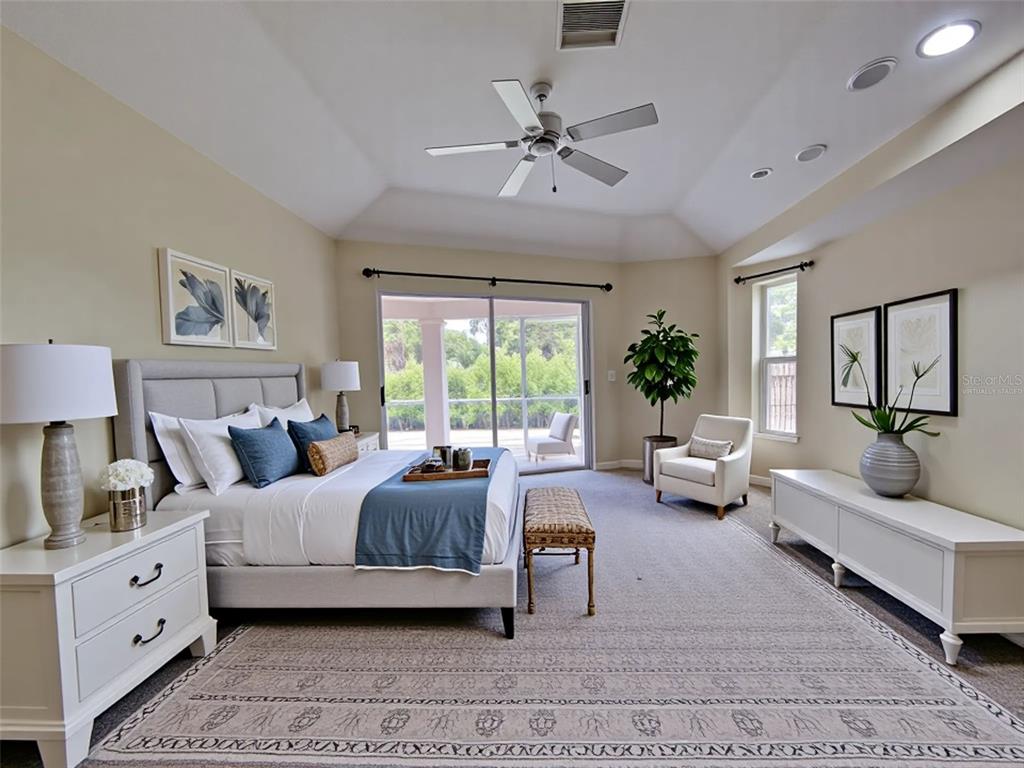 6265 Pheasant Road Venice, FL 34293 - Photo 67 of 70 a bedroom with a large bed and a couch