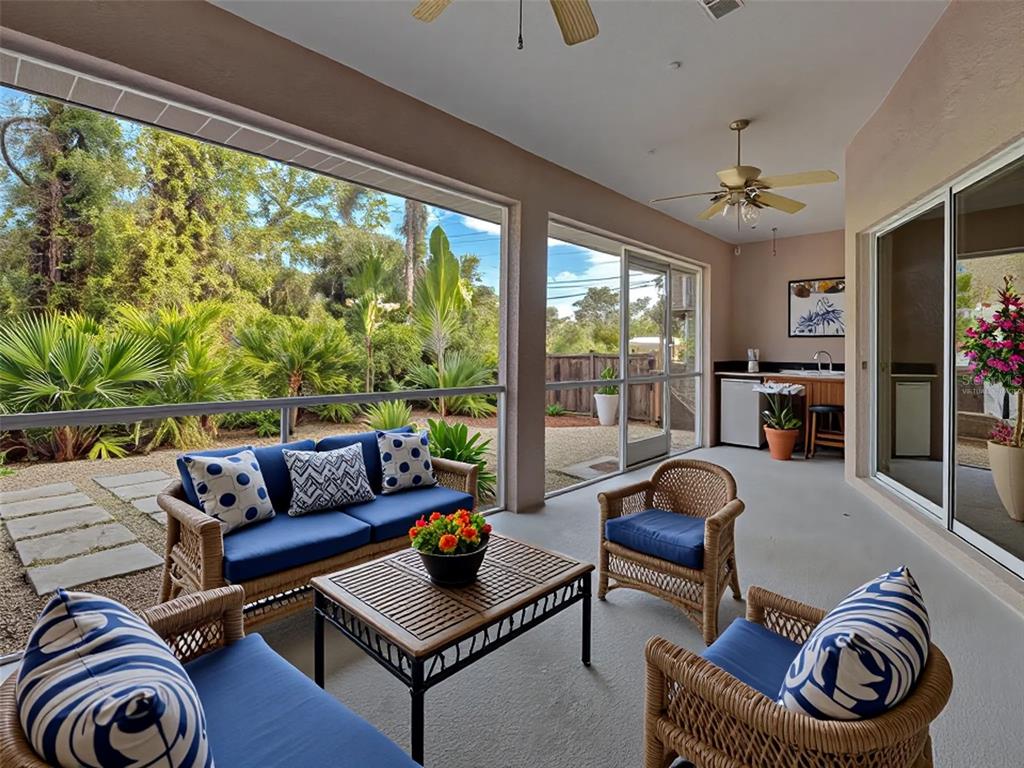 6265 Pheasant Road Venice, FL 34293 - Photo 68 of 70 a living room with furniture and a floor to ceiling window