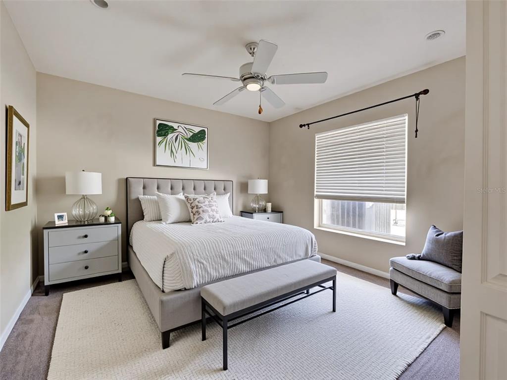 6265 Pheasant Road Venice, FL 34293 - Photo 70 of 70 a spacious bedroom with a bed and wooden floor