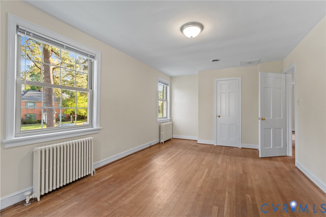 4804 Morrison Road Richmond, VA 23230 - Photo 32 of 48 a view of an empty room with wooden floor and a window