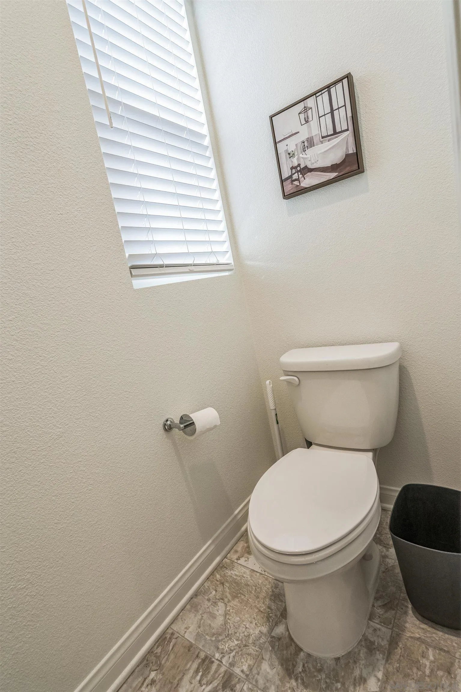 2018 Barite Street Spring Valley, CA 91977 - Photo 32 of 47 a white toilet sitting next to a window