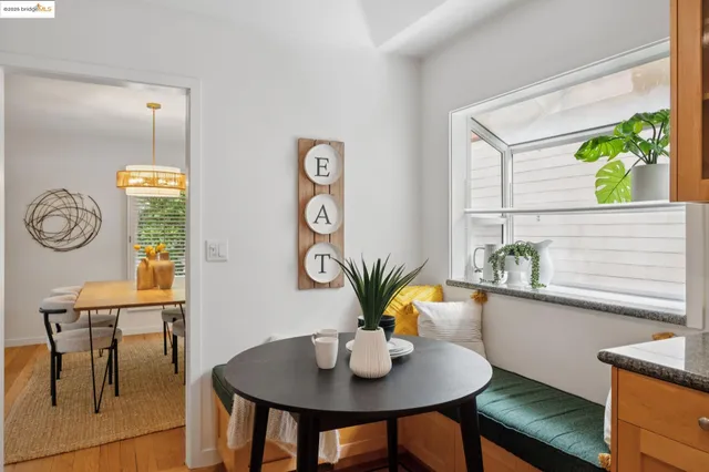 a kitchen with granite countertop stainless steel appliances a sink and cabinets