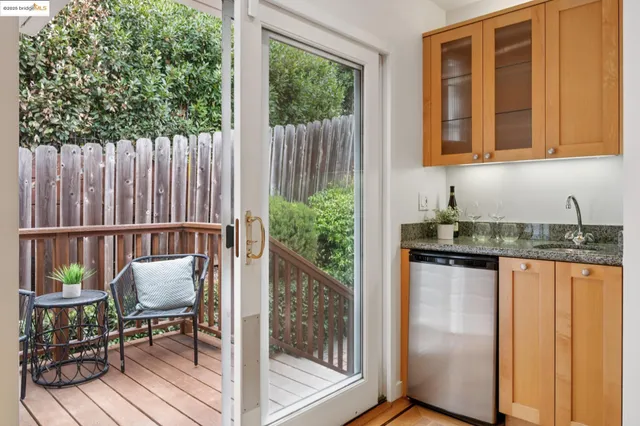 a living room with furniture plant and a large window