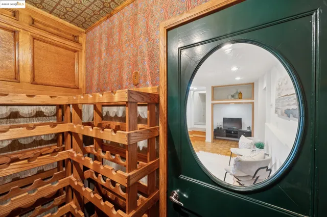 a view of a patio with couches and table and chairs with wooden fence