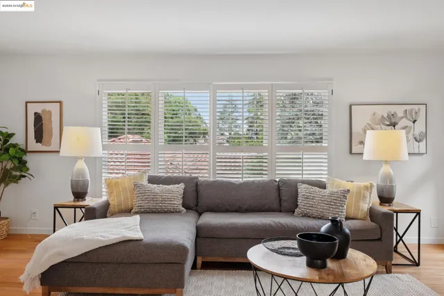 a living room with furniture and a chair