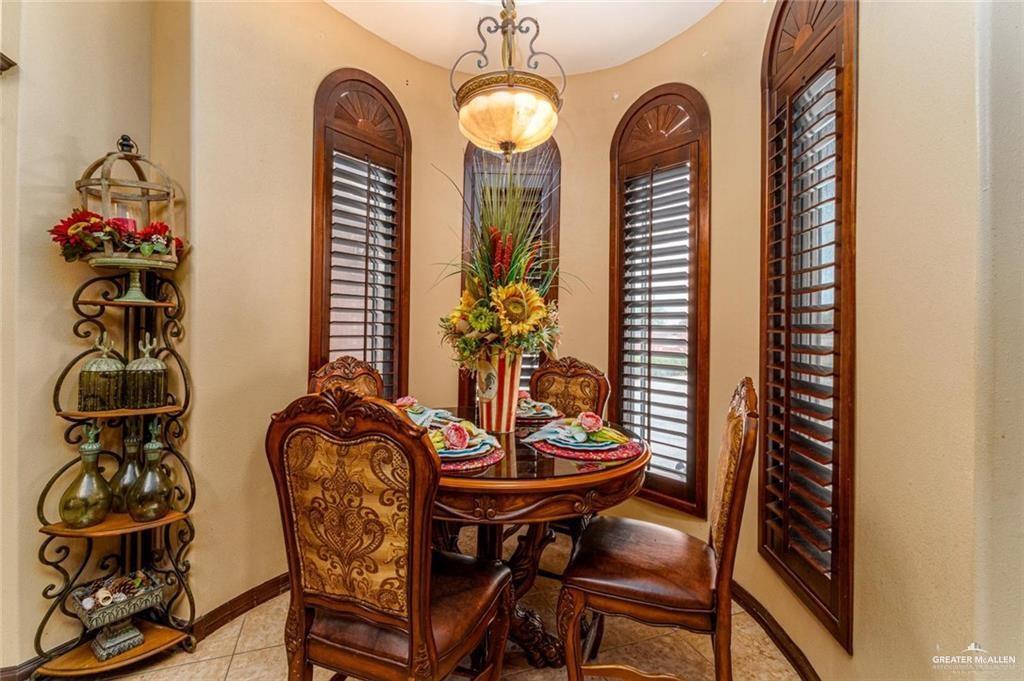426 North FM 649 Rio Grande City, TX 78582 - Photo 5 of 16 a view of a dining room with furniture and wooden floor