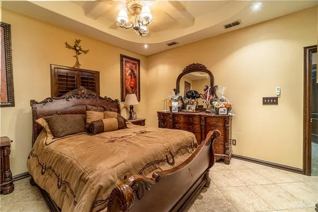 a bedroom with bed and wooden floor