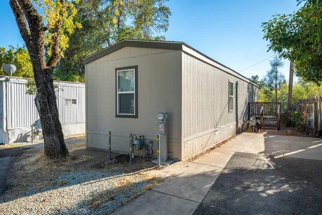 a backyard of a house with seating space