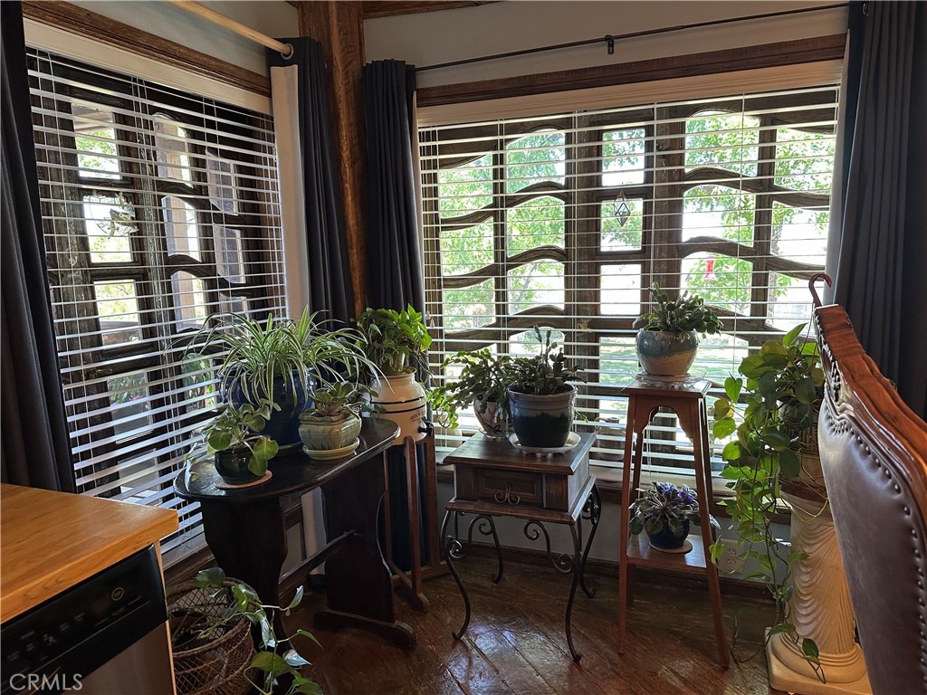 57260 Ramsey Road Anza, CA 92539 - Photo 18 of 44 a dining room with furniture and large windows