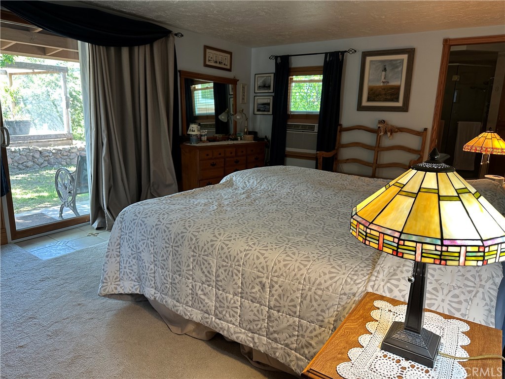 57260 Ramsey Road Anza, CA 92539 - Photo 26 of 44 a bed sitting in a bedroom next to a window