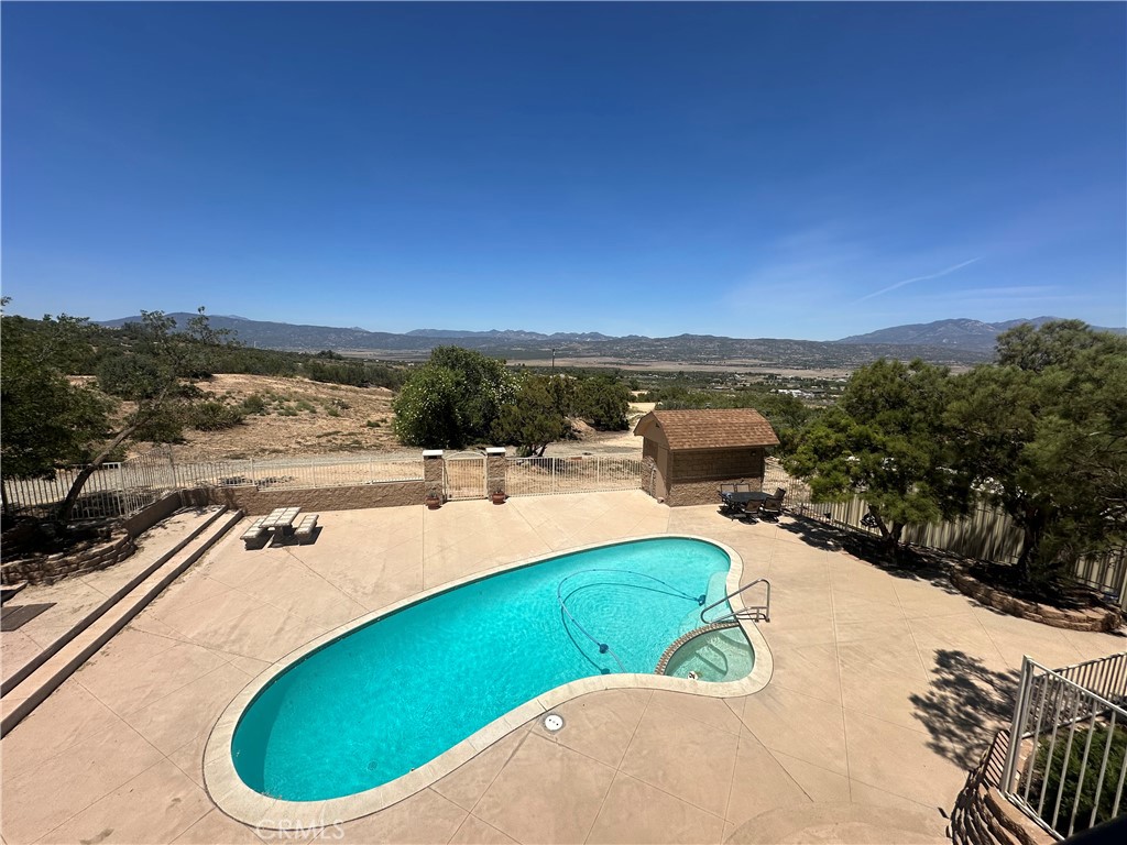 57260 Ramsey Road Anza, CA 92539 - Photo 43 of 44 a view of a swimming pool with a chairs