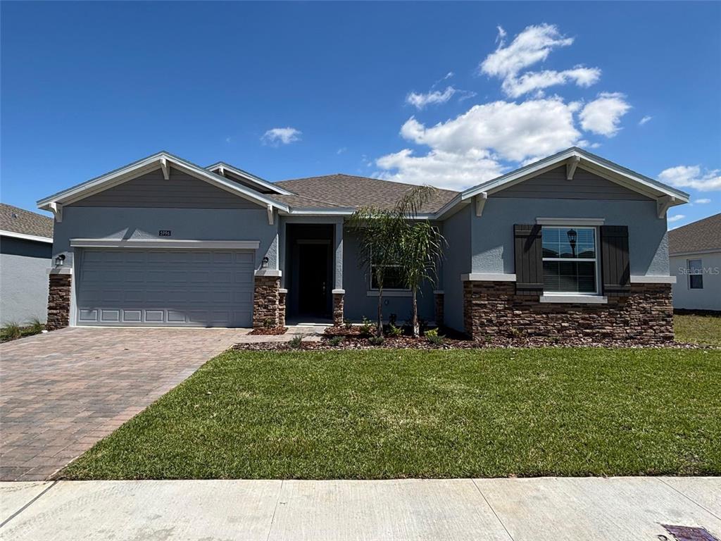 5996 Shavasana Road, Unit A Clermont, FL 34714 - Photo 1 of 1 a backyard of a house with table and chairs