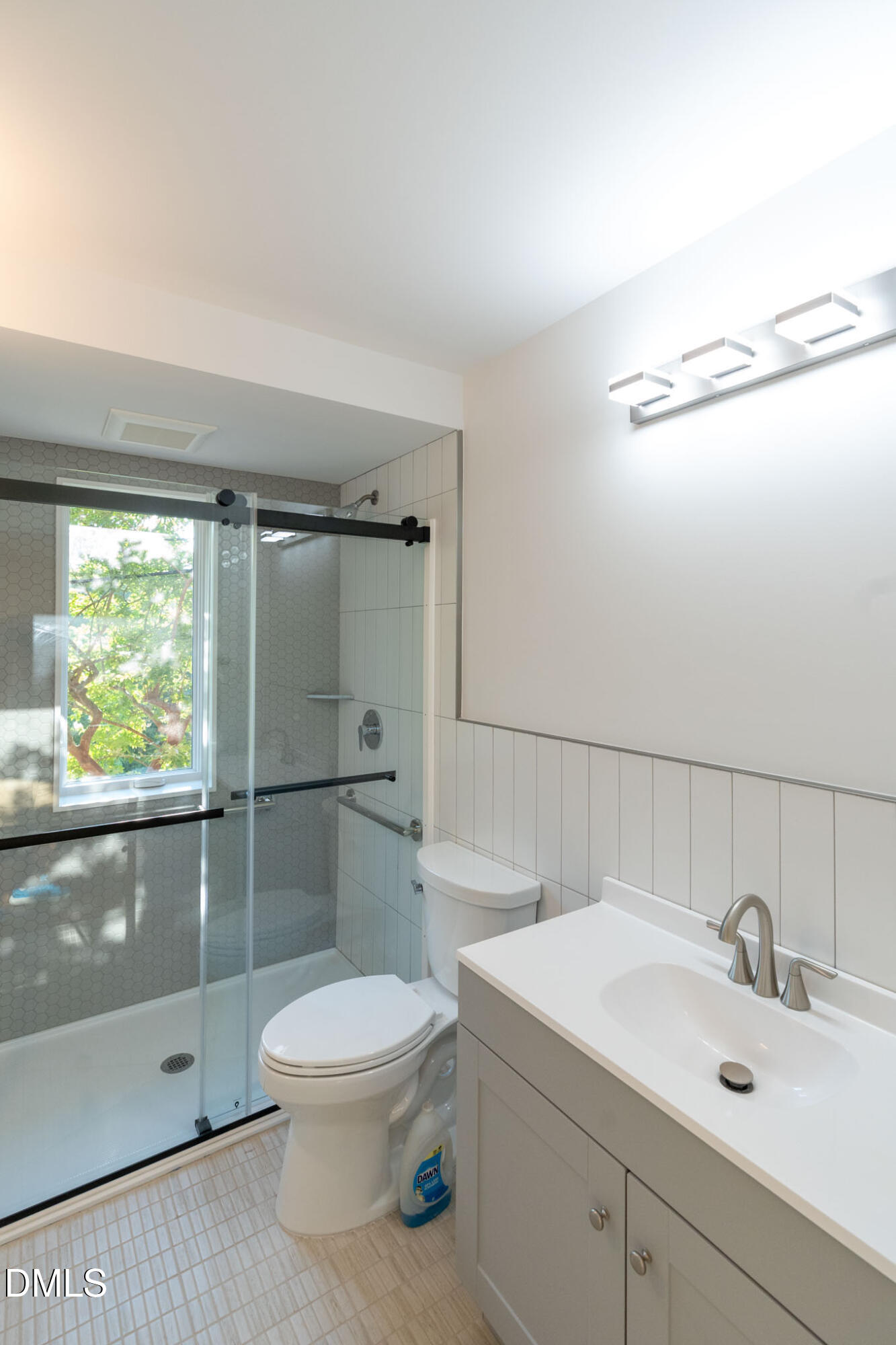402 East Martin Street Raleigh, NC 27601 - Photo 16 of 23 a bathroom with a sink mirror toilet and shower