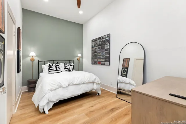 a bedroom with a bed and a table