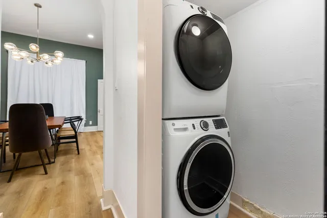 a view of a hallway with washer and dryer