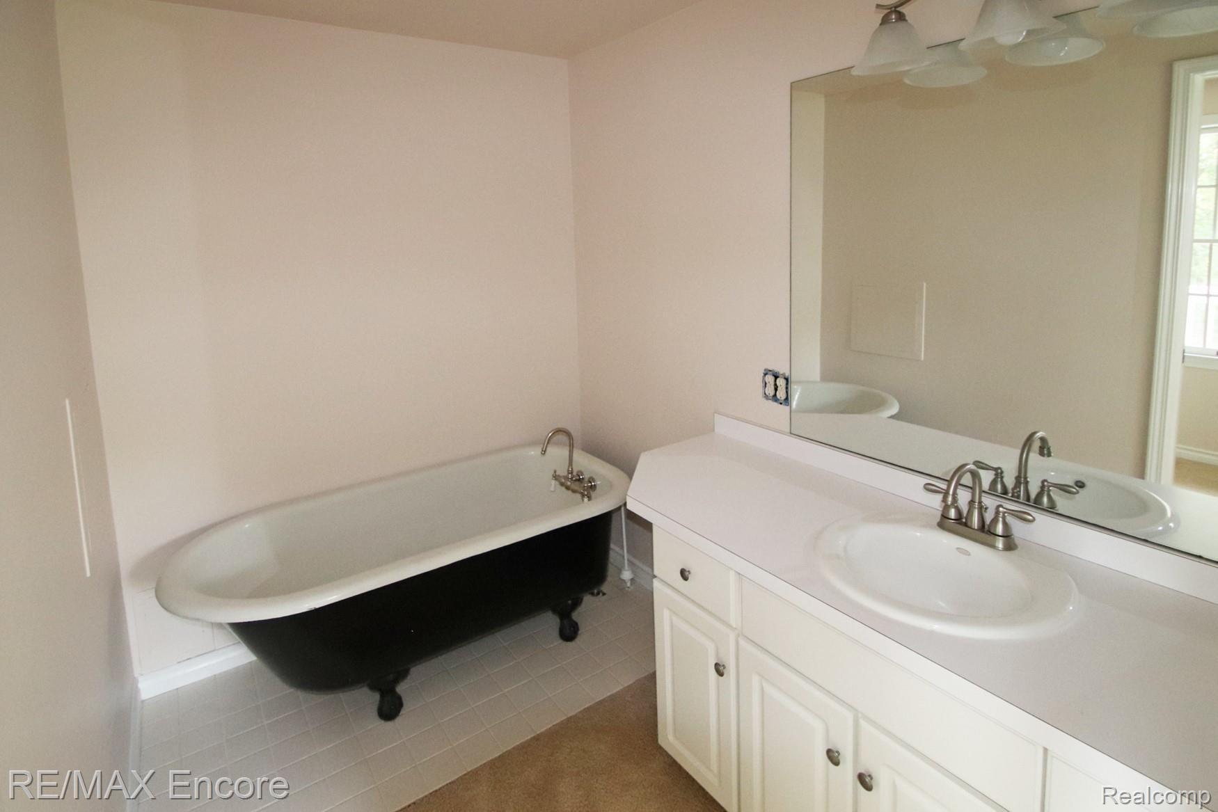 4210 Orion Road Rochester, MI 48306 - Photo 19 of 27 Master bathroom with shower separate from sink vanity