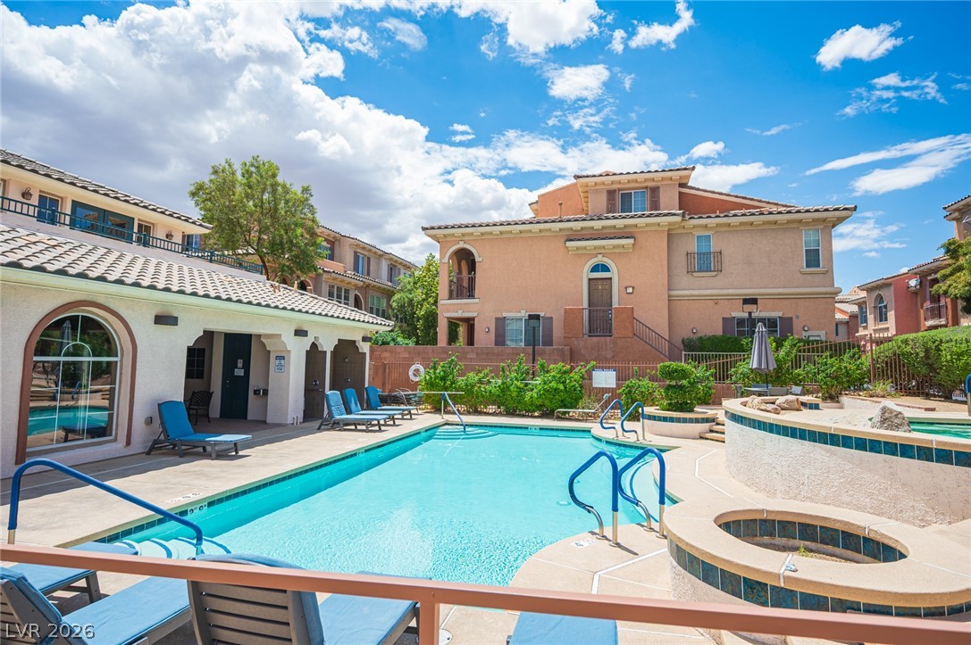 9916 Sable Point Street Las Vegas, NV 89178 - Photo 55 of 73 Lush landscaping surrounds the community pool and spa, offering a refreshing retreat.