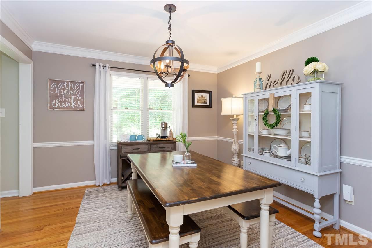 7701 Fiesta Way Raleigh, NC 27615 - Photo 3 of 27 a view of a dining room with furniture window and wooden floor