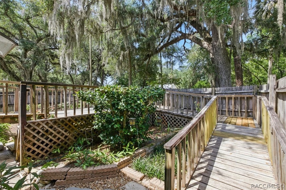 6 62nd Street Yankeetown, FL 34498 - Photo 30 of 55 a view of balcony with wooden floor and fence