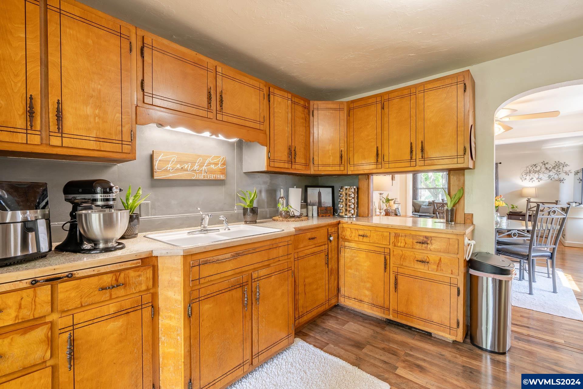 1530 2nd Avenue Albany, OR 97321 - Photo 15 of 35 a kitchen with stainless steel appliances granite countertop a stove and cabinets