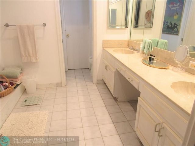 a bathroom with a sink a vanity and a mirror