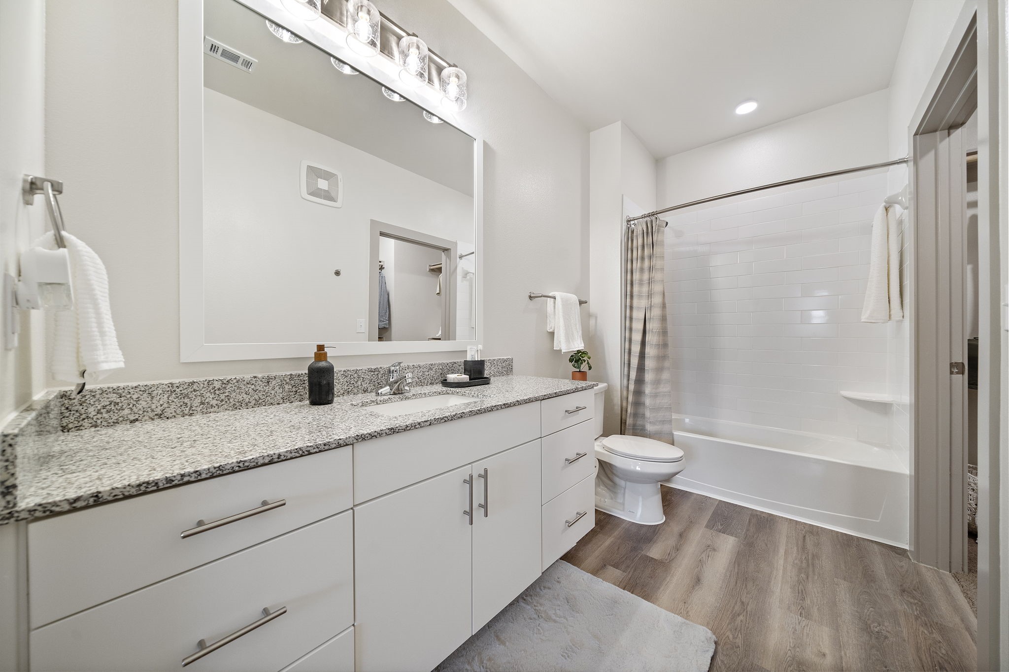 10485 League Line Road, Unit 4206 Conroe, TX 77304 - Photo 4 of 11 a bathroom with a double vanity sink toilet and shower