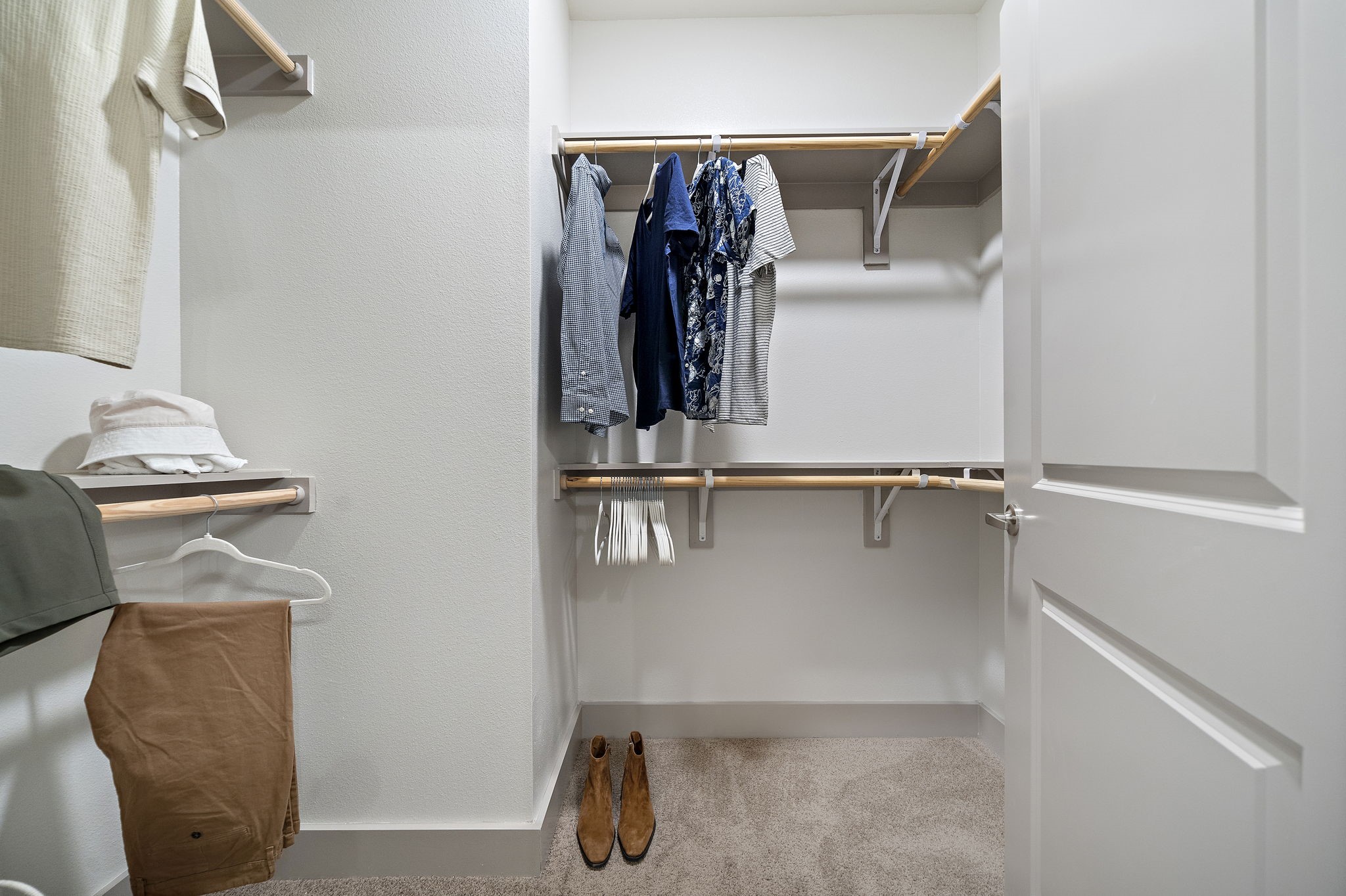 10485 League Line Road, Unit 4206 Conroe, TX 77304 - Photo 8 of 11 a view of walk in closet with clothes and shoes