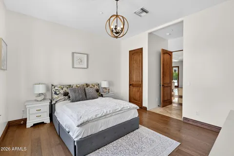 a bedroom with a bed and a dresser