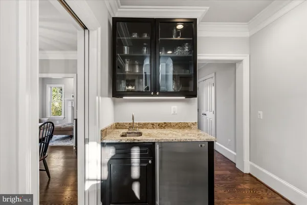 a bedroom with a bed and a mirror