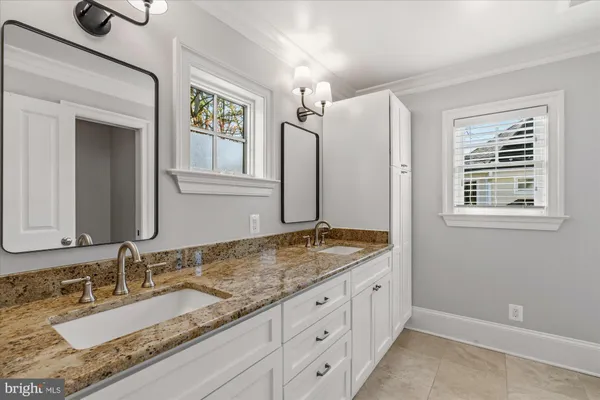 a living room with furniture a couch and a couch