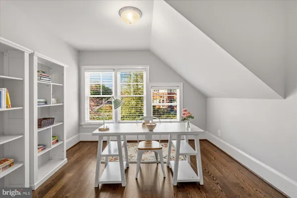 a view of a house with backyard sitting area and porch