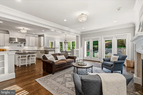 a living room with furniture a fireplace and window