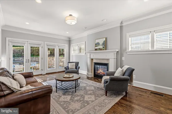 a kitchen with stainless steel appliances kitchen island granite countertop a refrigerator and a stove top oven