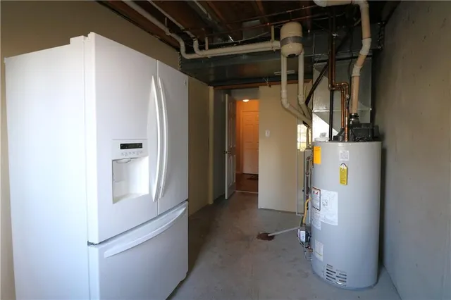 a view of a house with a yard and a garage