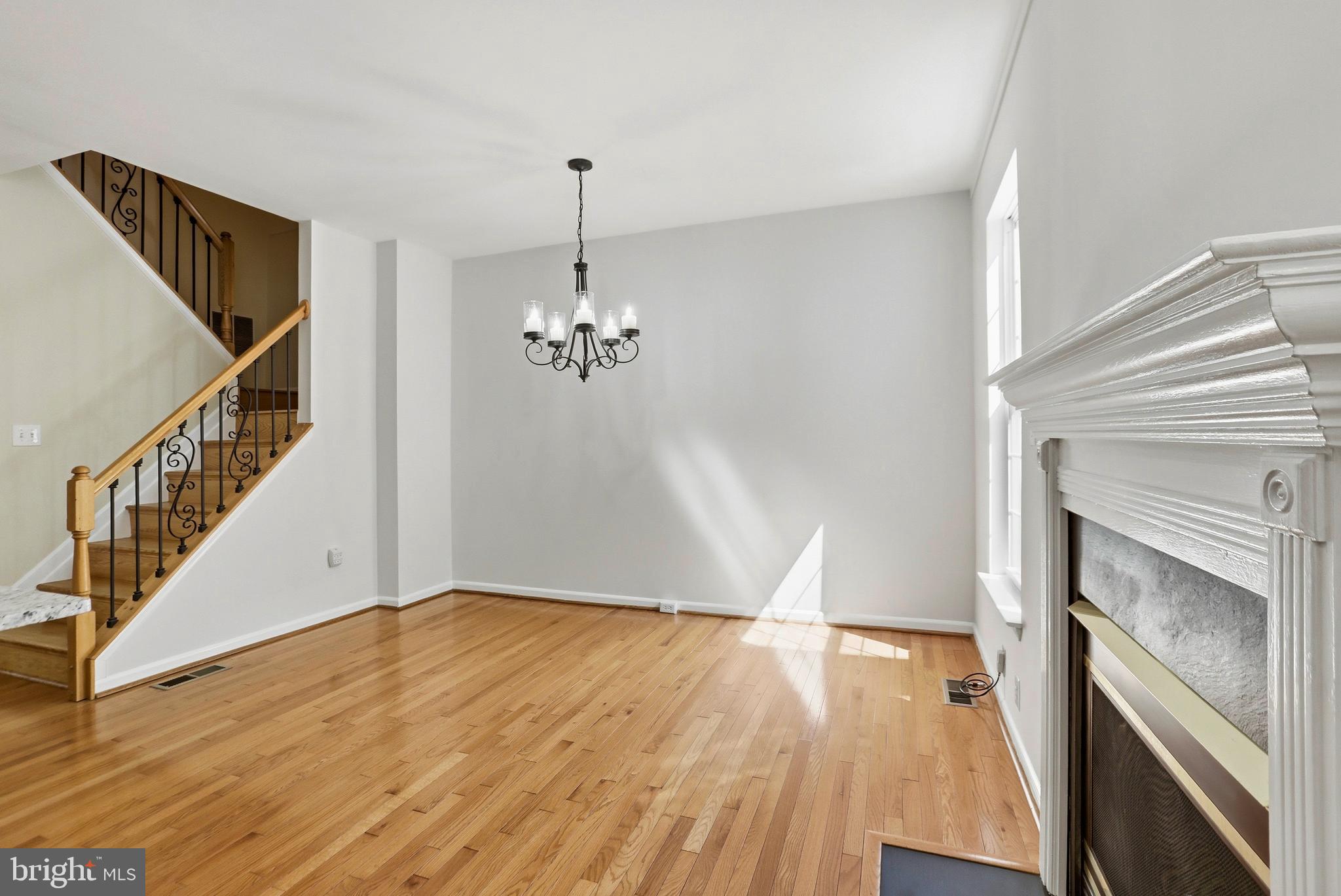 21648 Frame Square Broadlands, VA 20148 - Photo 13 of 36 a view of an empty room with wooden floor and a window