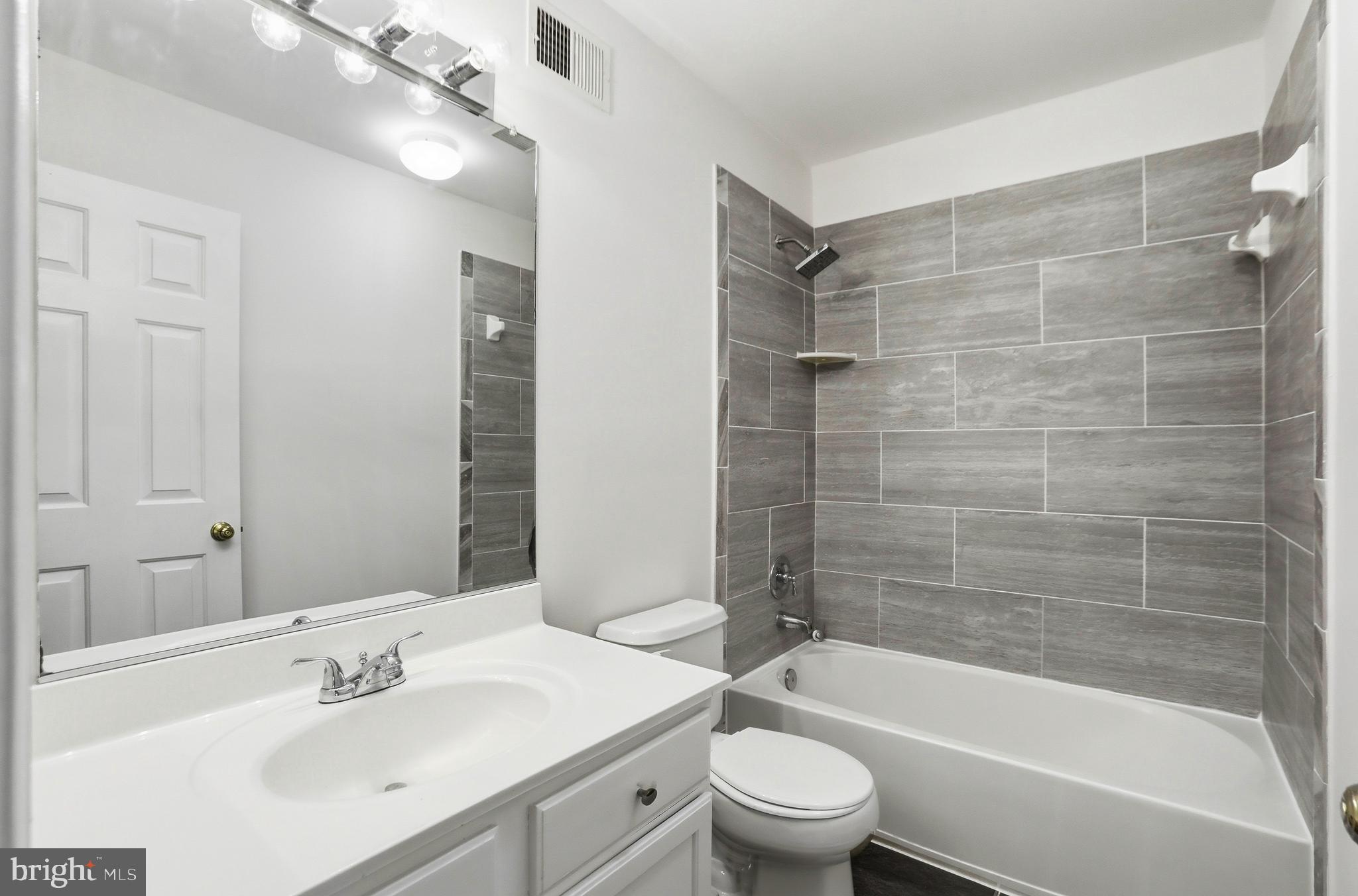 21648 Frame Square Broadlands, VA 20148 - Photo 25 of 36 a bathroom with a bathtub shower sink vanity and toilet