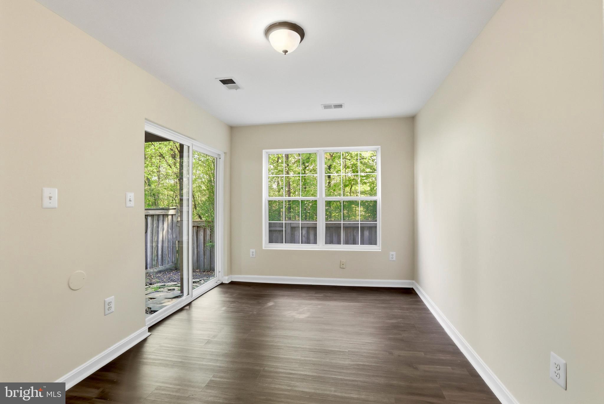 21648 Frame Square Broadlands, VA 20148 - Photo 30 of 36 an empty room with wooden floor and windows